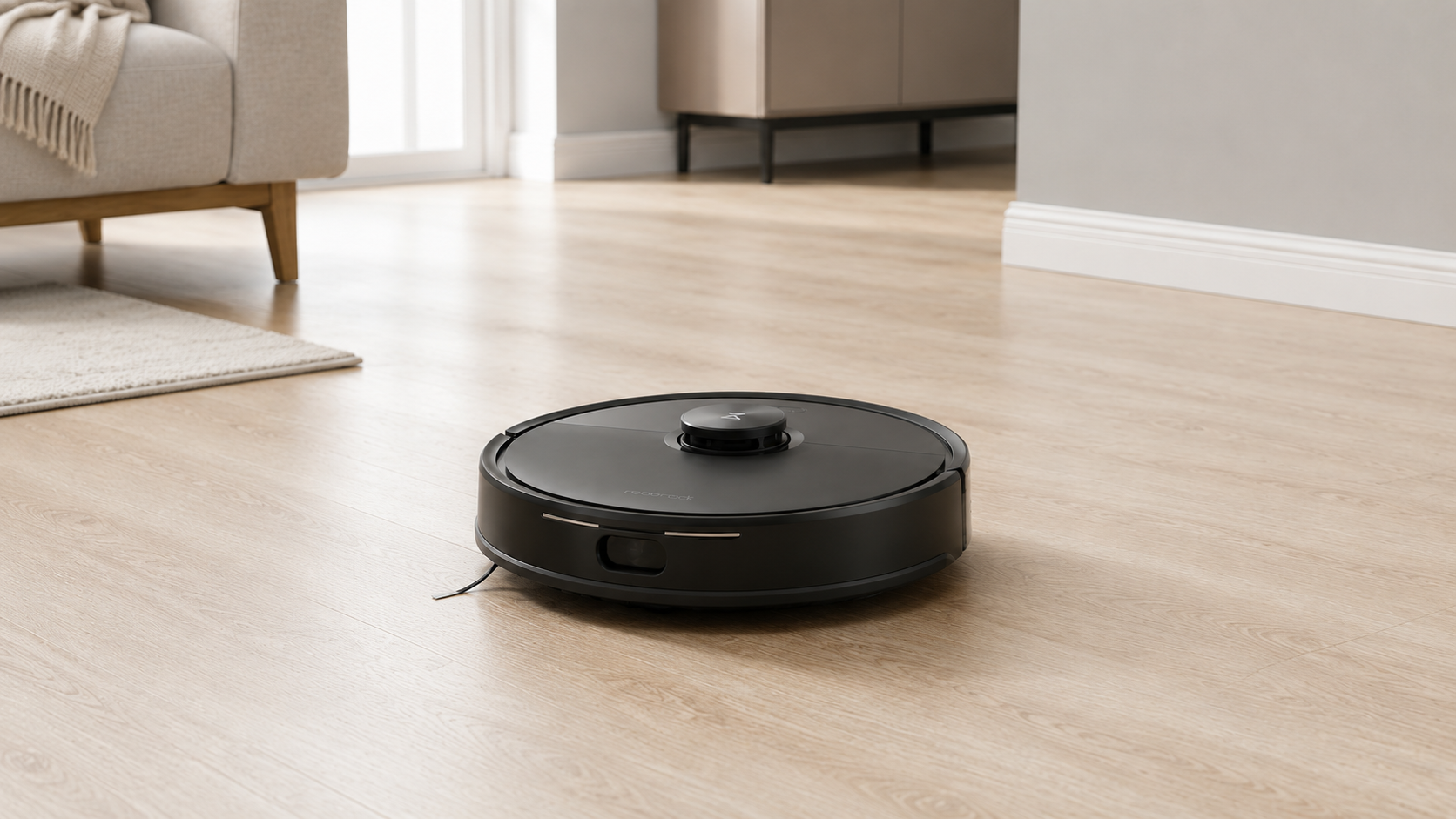 Roborock Q7 M5 robot vacuum cleaning a wood floor in a bright living room